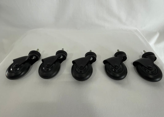A set of five black replacement casters aligned in a row on a white background.