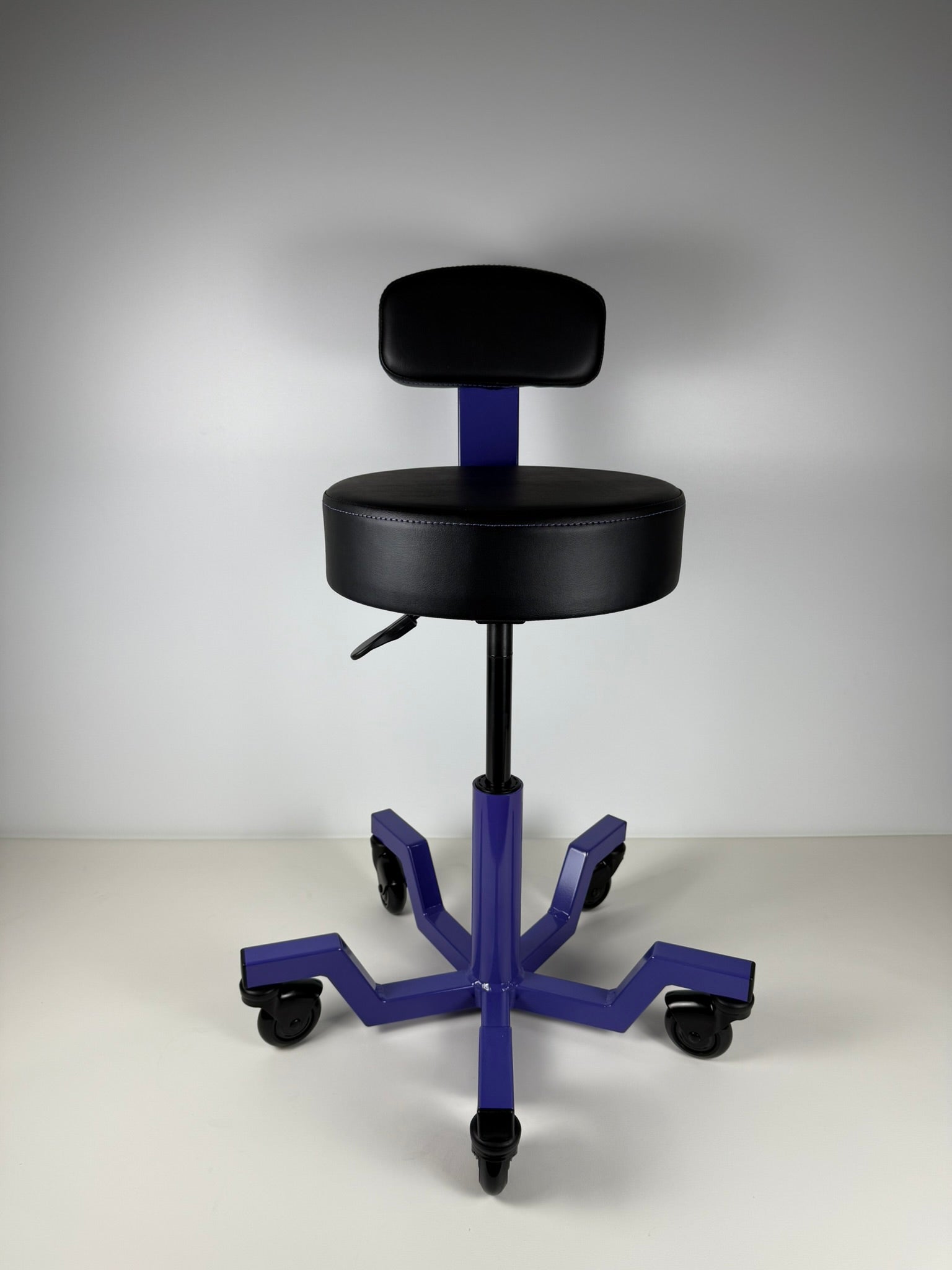 Black stool with blue base on a gray background