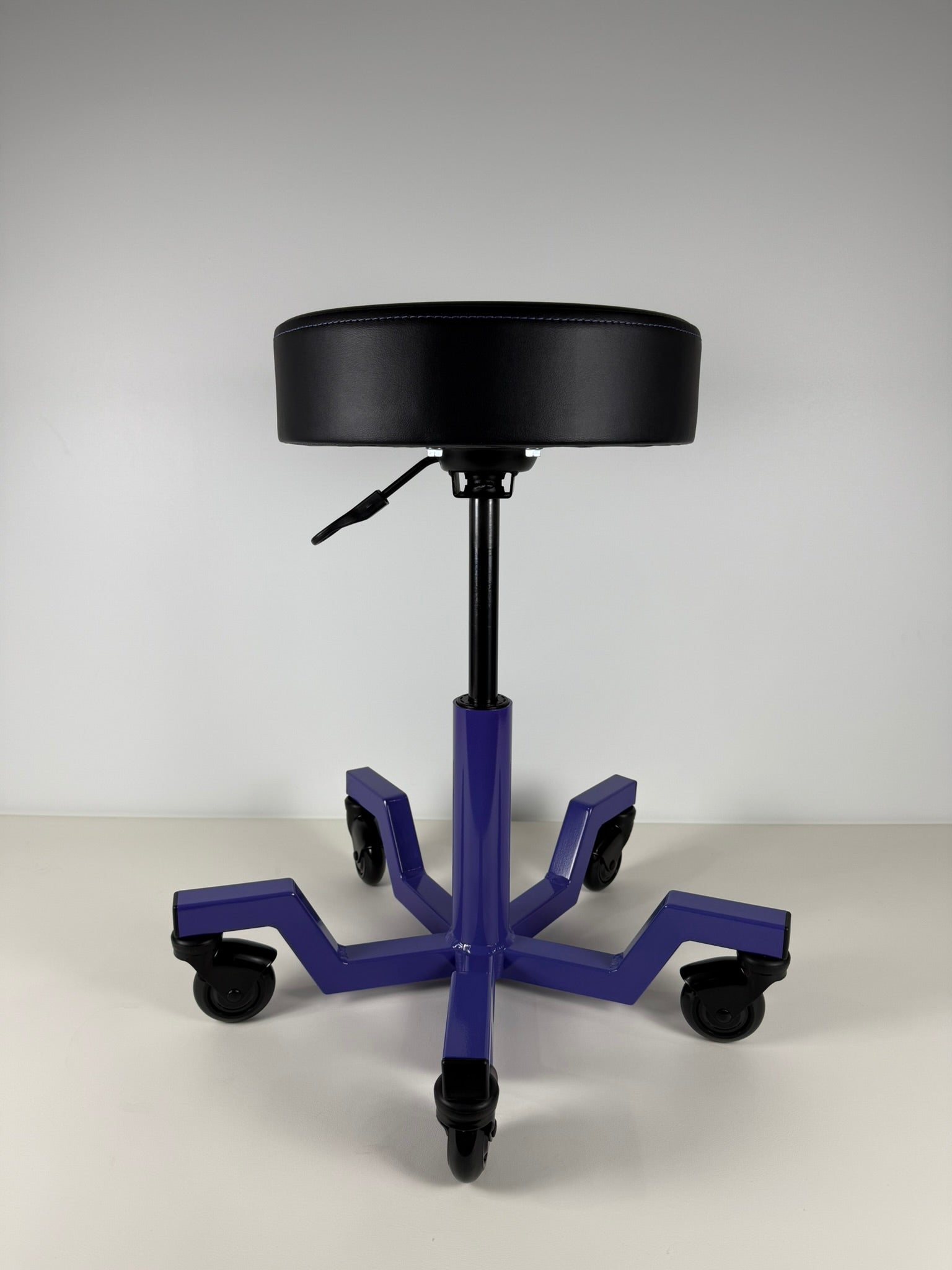 purple adjustable heavy-duty stool on a white background