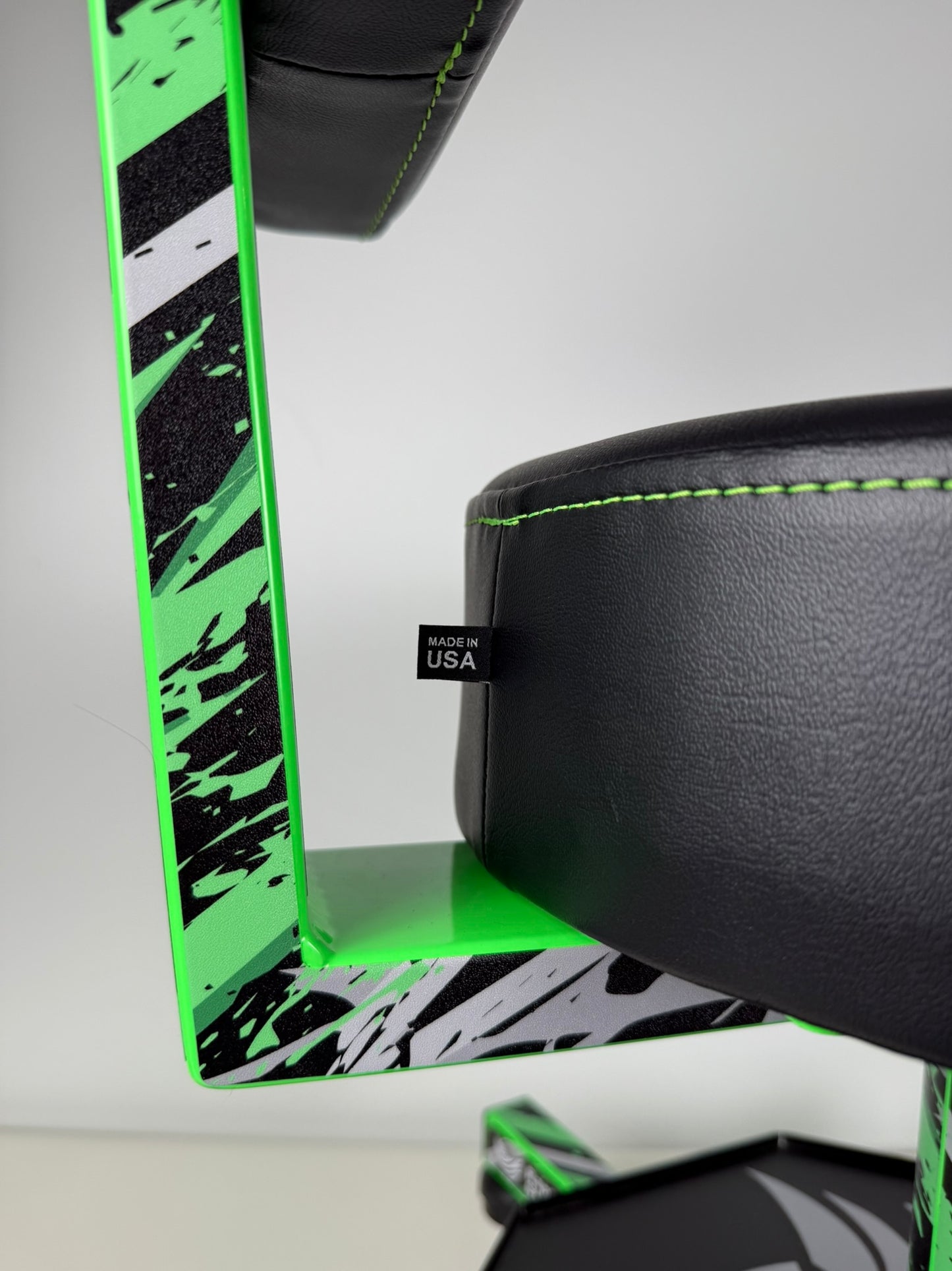 Black lime green chair with green accents on a white background